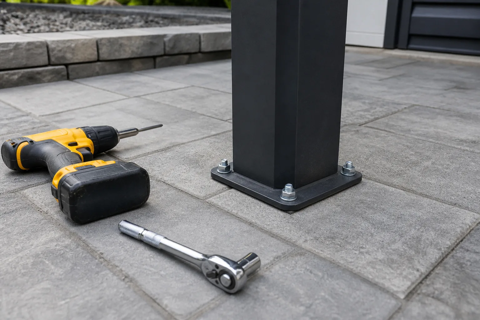 Pergola post base plate with anchor bolts on a concrete patio slab